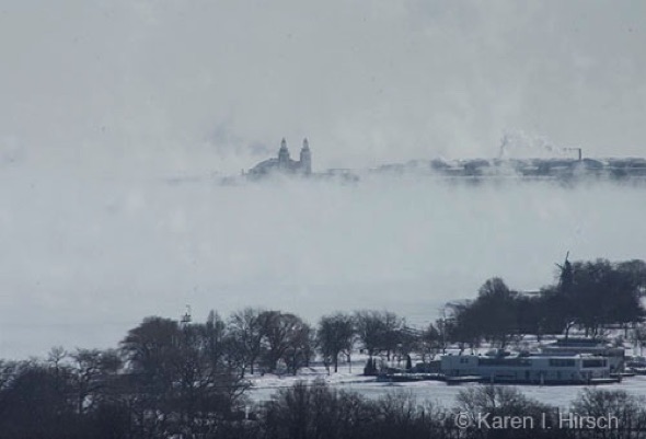 Steam rising from Lake Michigan engulfs Navy Pier